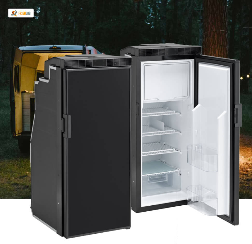 Compressor refrigerators on a woodland background with a van in the background
